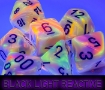Chessex (22442): Mega-Hedral 7-Die Set: Festive (Circus / Black) Black Light Reactive - CHX22442 [601982043797]